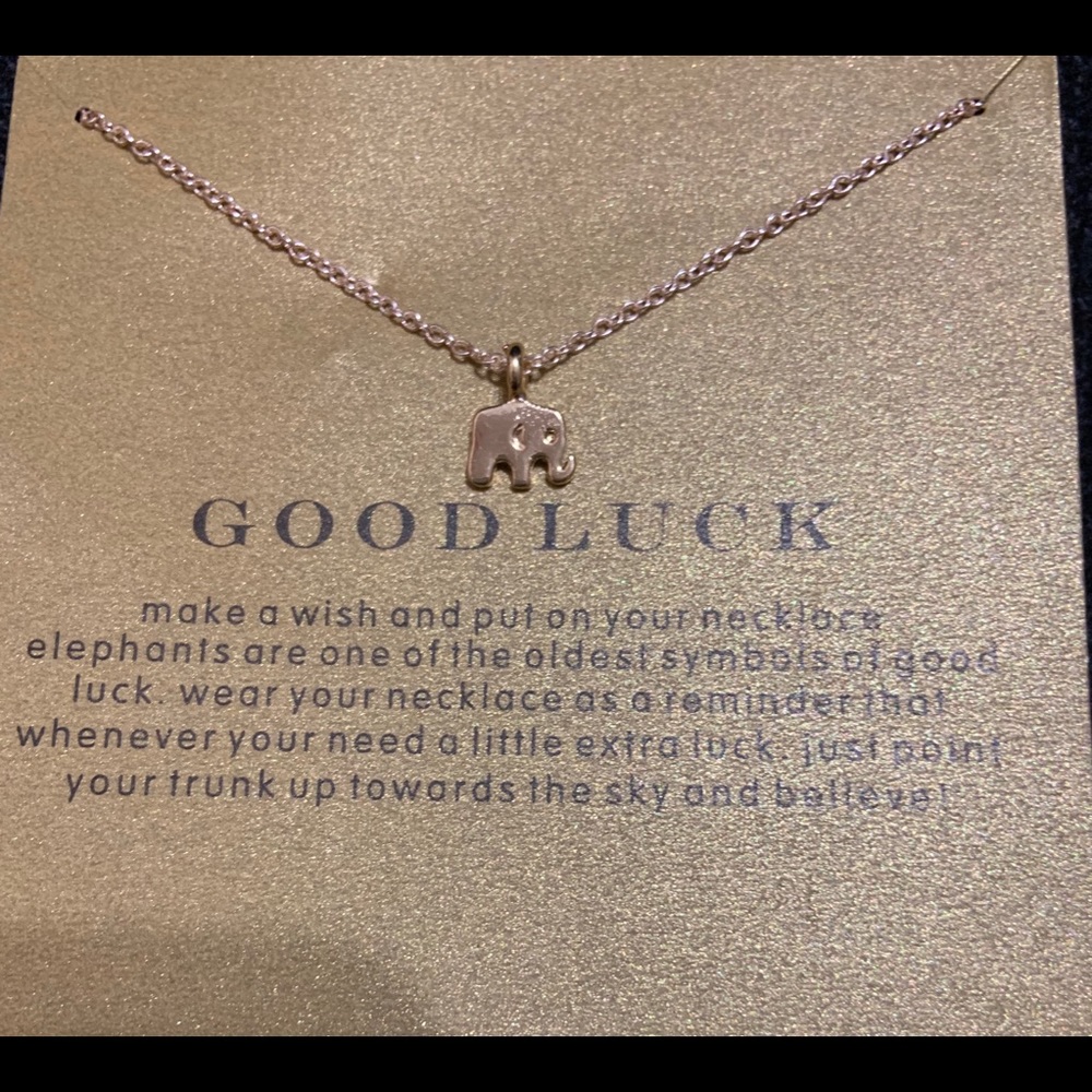 Gold elephant necklace with cute gold paper.